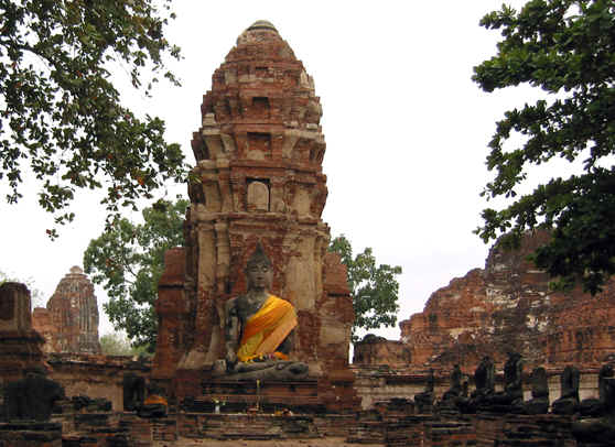 Buddha statue with Stupa behind it, Ayutthaya, Thailand