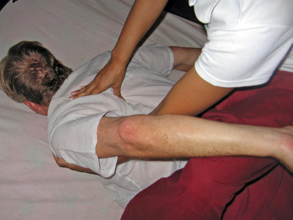 May is getting into the nooks and crannies for hidden tension. Thai massage, Chiang Mai, Thailand