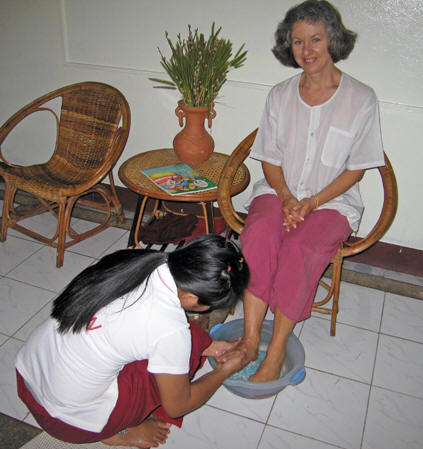 Akaisha having her feet washed by Thai massage technician. Chiang Mai, Thailand