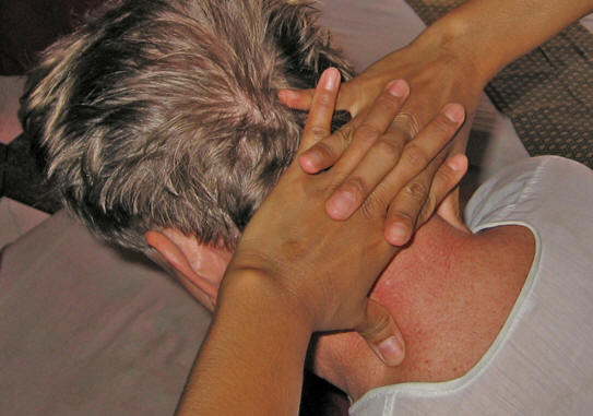 Releasing the neck of tension. Thai massage, Chiang Mai, Thailand