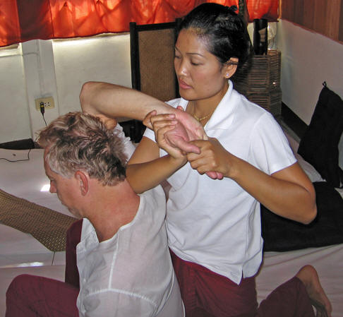 This looks awkward, but there is leverage and pressure. Thai massage, Chiang Mai, Thailand