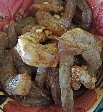 Fresh shrimp marinating in secret sauce