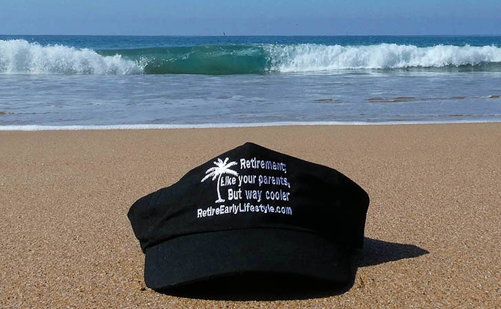 Retire Early Lifestyle hat on the beach