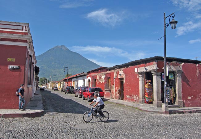 Cobblestone streets with Vulcan Agua in the background in Antigua, Guatemala