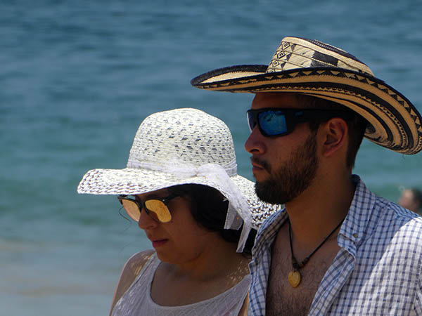 Man and woman in strking contrast, Chacala Beach, Mexico
