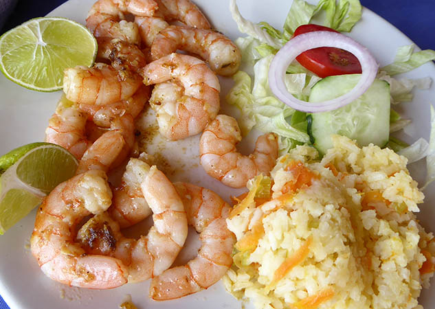 A plate of shrimp in garlic butter