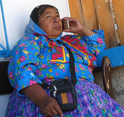 Indigenous woman in Creel, Mexico with cell phone Copper Canyon, El Chepe train