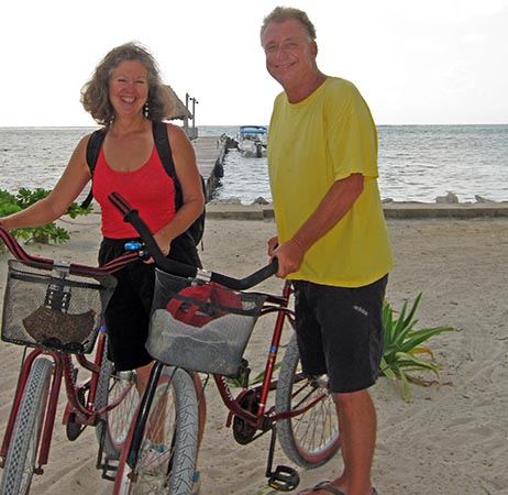 Billy and Akaisha bicycling on the Beach in Belize