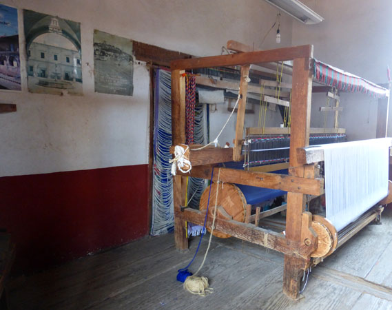 An old pedal-driven European weaving loom