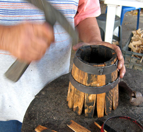 Hammering of the staves into a smaller barrel