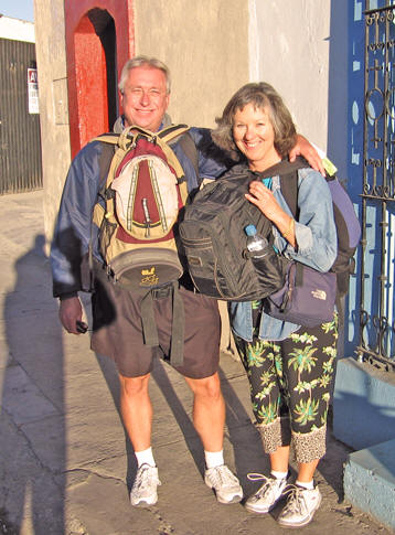 Billy and Akaisha with their backpacks, ready to go traveling