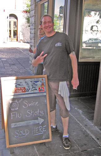 Man giving the Peace sign outside an Austin Restaurant, Texas