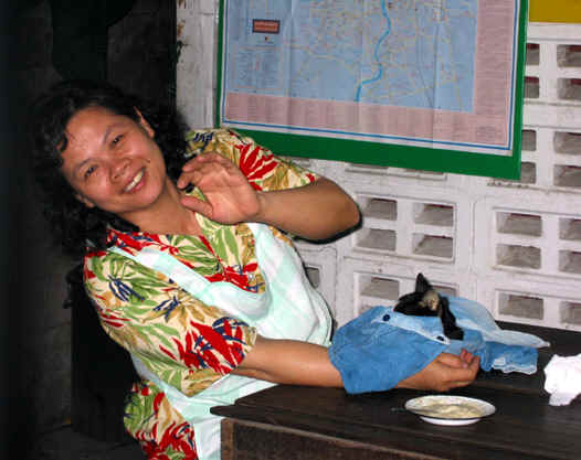 SEH HAND FEEDING HER AILING CAT