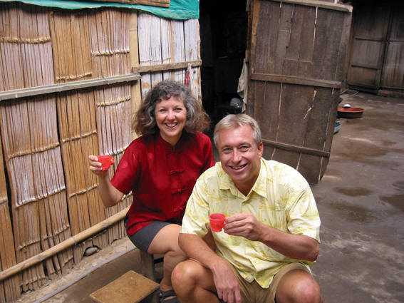Akaisha and Billy Sampling the homemade hootch, Ganlanba, China