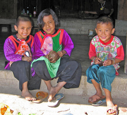 Children dressed in their velvet finery at the Lisu Village were all smiles.