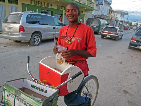 A Belizean street vendor selling hot meat pies. Orangewalk, Belize