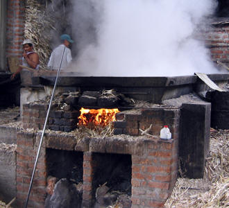 Once reduced, the panela is moved to a cooling table,