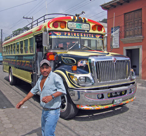 The Famous 'Chicken Bus' and Handler, in Guatemala
